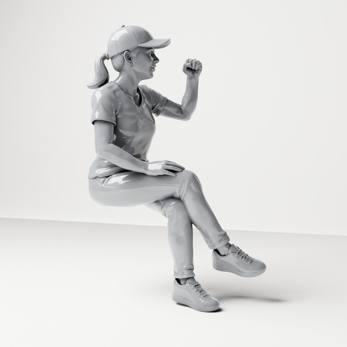 Diorama modelbouw productfoto 3: Zittende figuur: toeschouwster met gekruiste benen en geheven vuist (B057)