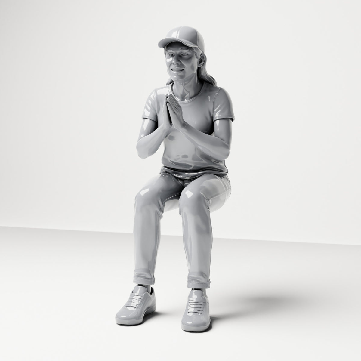 Diorama modelbouw productfoto 0: Zittende figuur: toeschouwster met de handen gevouwen voor de borst (B058)