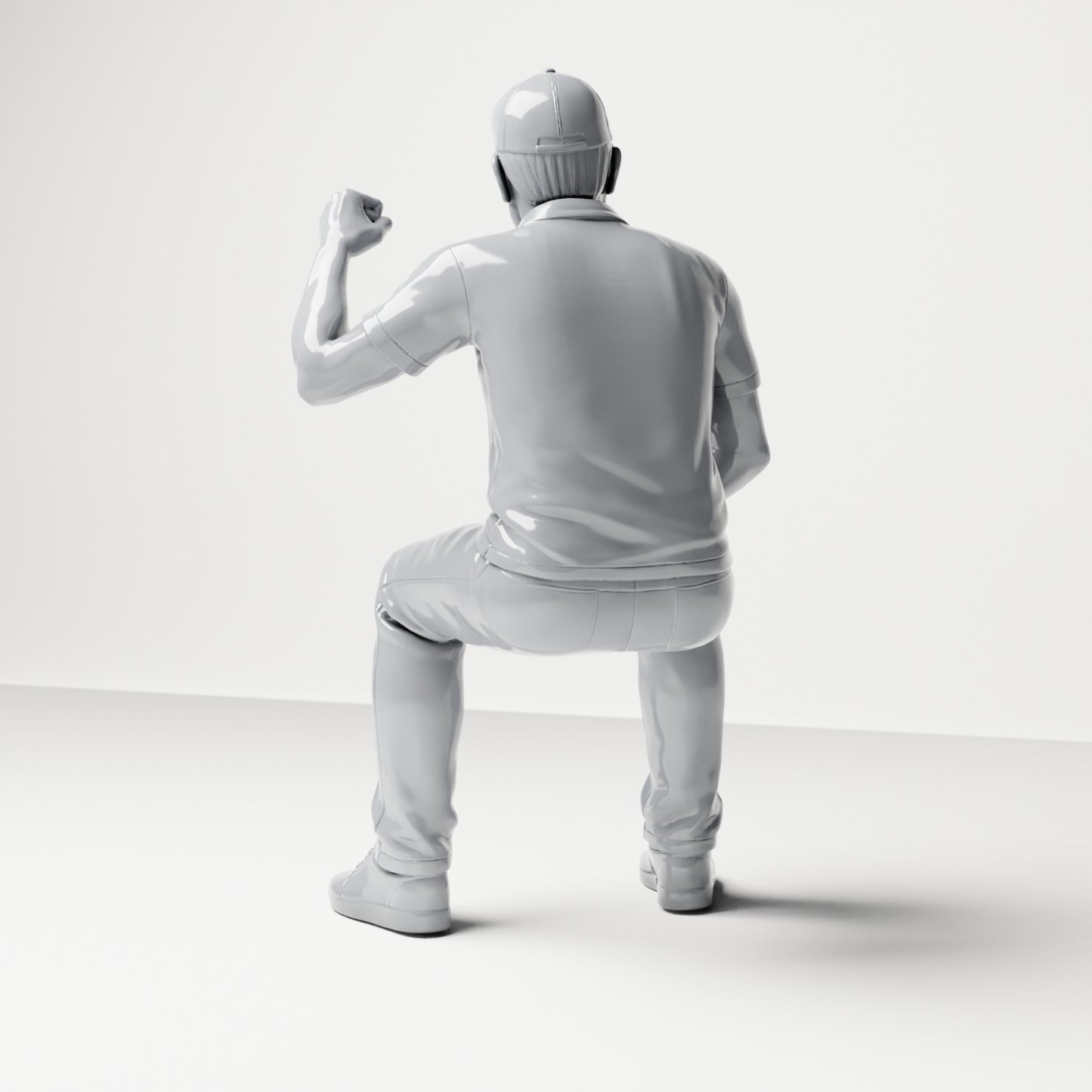 Diorama modelbouw productfoto 2: zittende figuur: mannelijke toeschouwer met opgeheven gebalde vuist (B065)