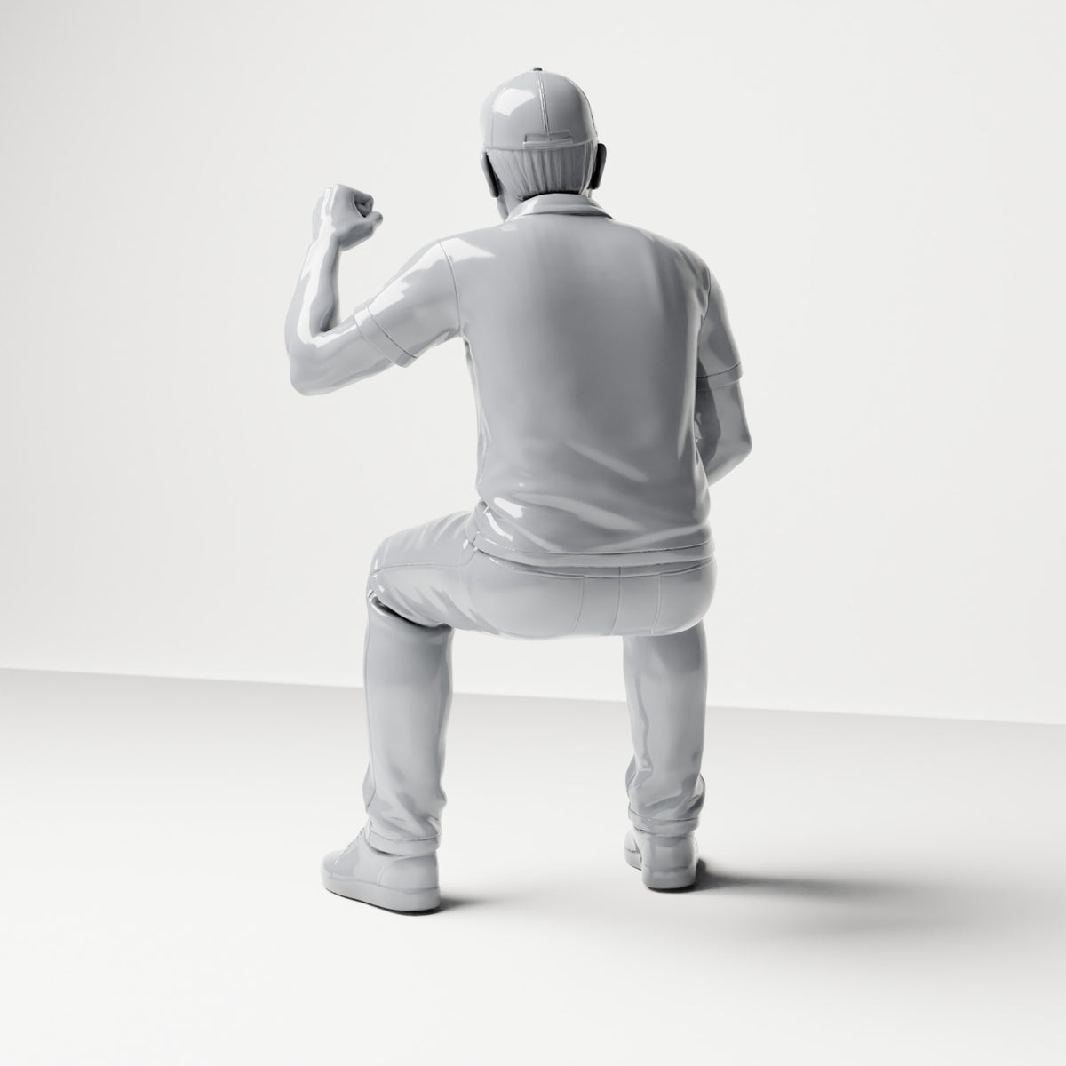 Diorama modelbouw productfoto 2: zittende figuur: mannelijke toeschouwer met opgeheven gebalde vuist (B065)