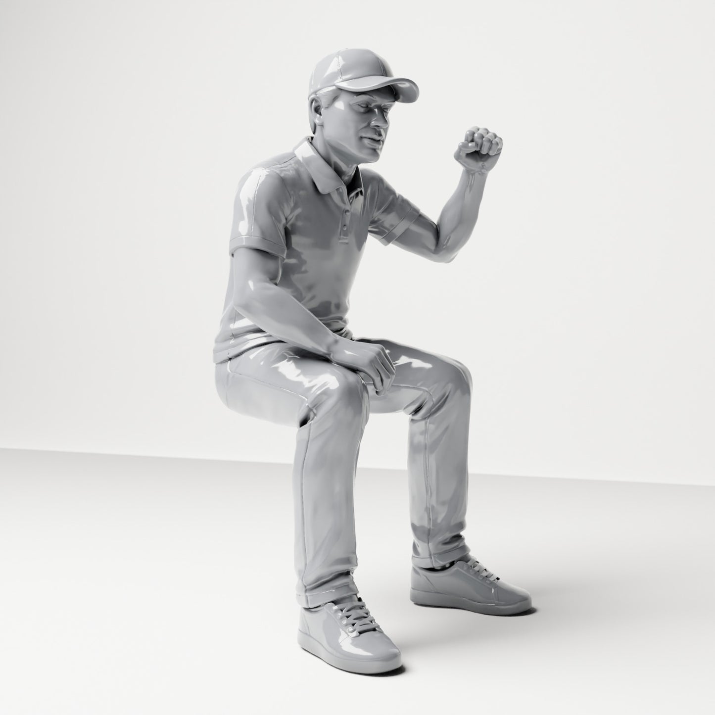 Diorama modelbouw productfoto 3: Zittende figuur: Mannelijke toeschouwer met opgeheven gebalde vuist (B065)