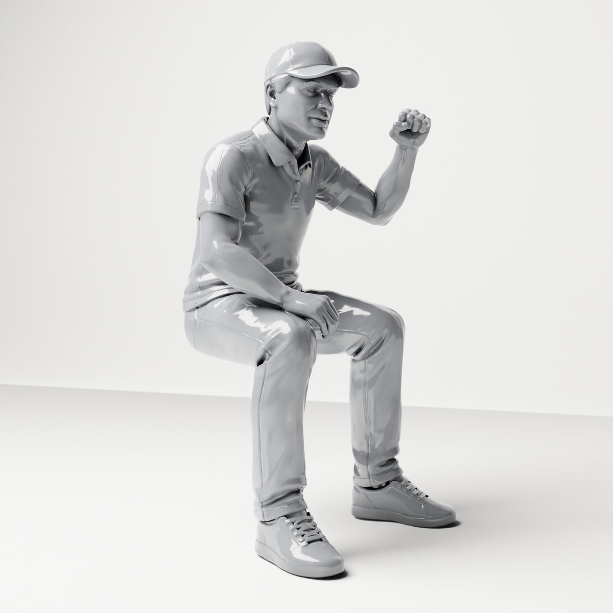Diorama modelbouw productfoto 3: Zittende figuur: Mannelijke toeschouwer met opgeheven gebalde vuist (B065)