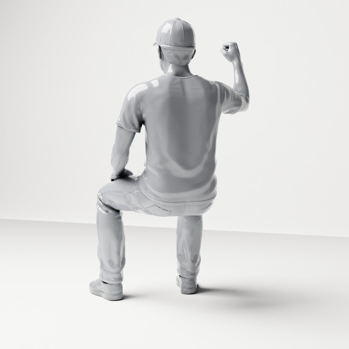 Diorama modelbouw productfoto 2: zittende figuur: toeschouwer met opgeheven gebalde vuist (B066)