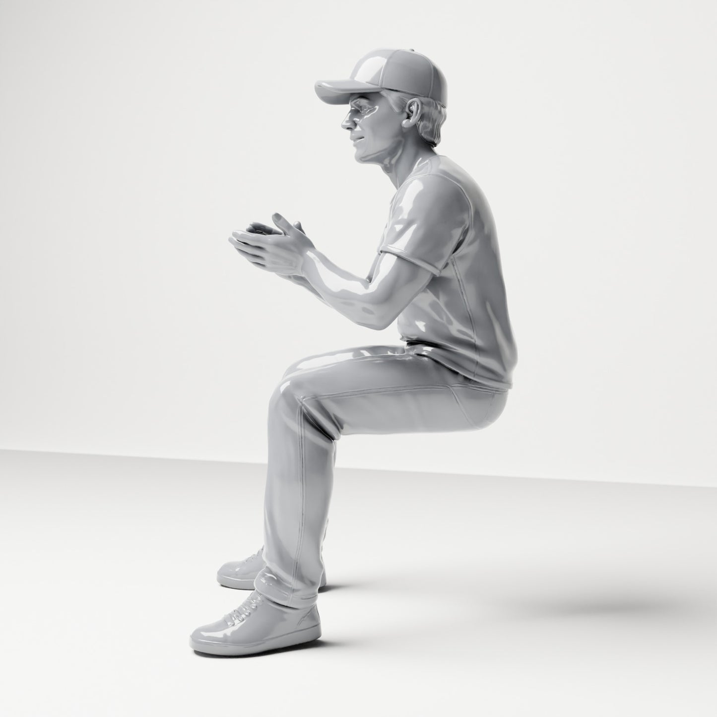 Diorama modelbouw productfoto 1: Zittende figuur: Mannelijke toeschouwer met pet en samengebrachte handen (B068)