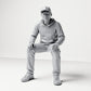 Diorama modelbouw productfoto 0: Zittende figuur: man met pet & hoodie (B070)