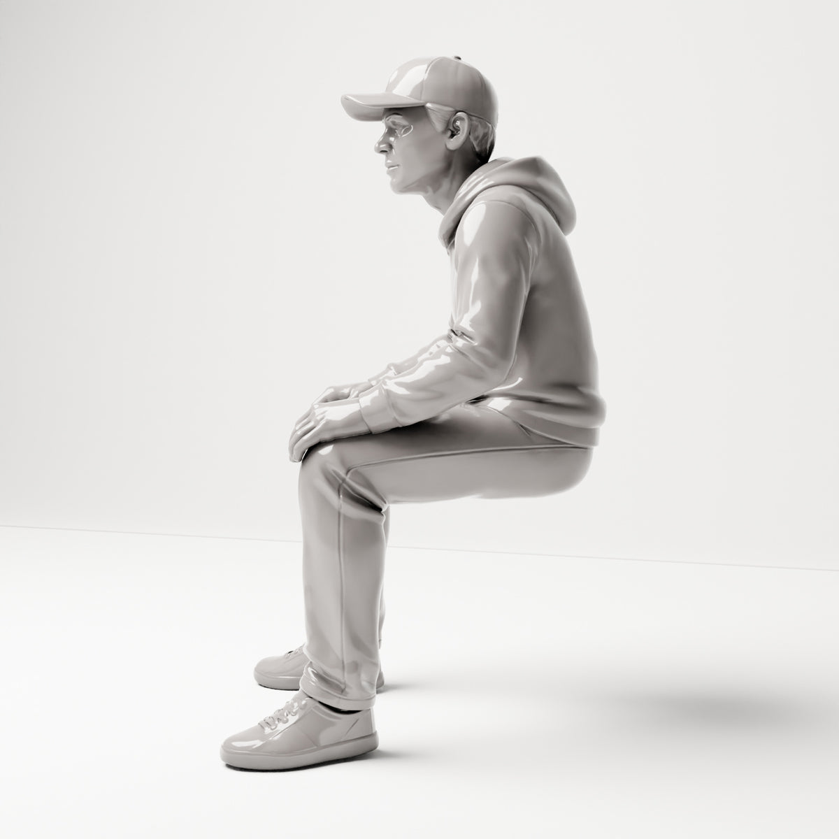 Sitzende Figur: Mann mit Kappe & Kapuzenpullover (B070) - linke Seitenansicht
