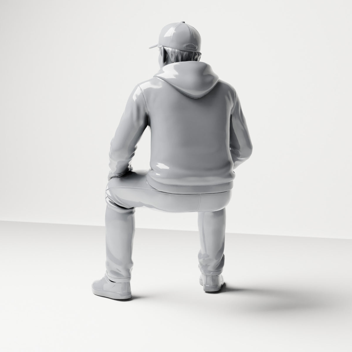 Diorama-modelbouw productfoto 2: zittende figuur: man met pet en capuchontrui (B070)