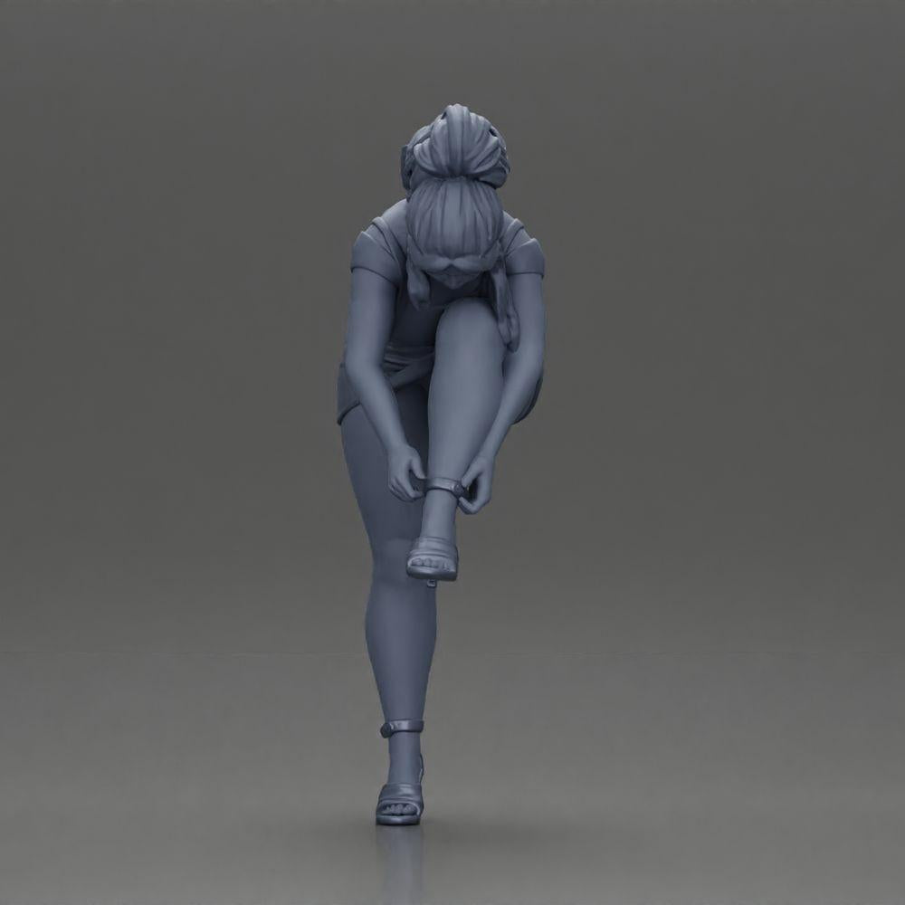 Diorama modelbouw productfoto 11: Diorama figuur: Miniatuurfiguur - Vrouw trekt rode hoge hakken aan, staande pose voor diorama (Ref Nr. A112)