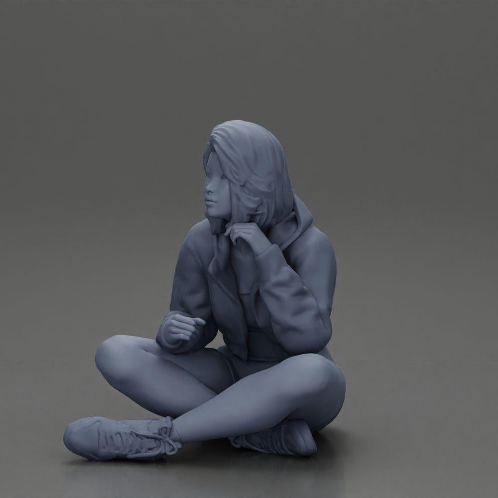 Diorama modelbouw productfoto 20: Diorama-miniatuur: Zittende vrouw in jas en shorts met open paraplu (Ref Nr. A85)