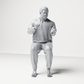 Diorama Modellbau Produktfoto 7: Sitzende Figur: Gestikulierender Mann mit Pullover, Hose & Flip-Flops (a165)
