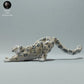 Productfoto dierenfiguur Animal Den Miniatures 0: wild dierfiguur: sneeuwluipaard - zich uitrekkend (22_12_19)