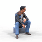 Productfoto diorama en modelbouw miniatuur figuur: man in leren jack en zonnebril zittend